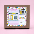 box of building blocks with Collage Collage store front image and built example on a 1/20 box