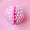 Paper honeycomb ball decoration in rose pink and 8 inches across