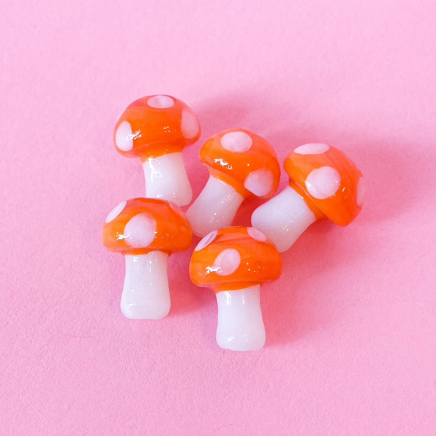 Glass mushroom beads in orange