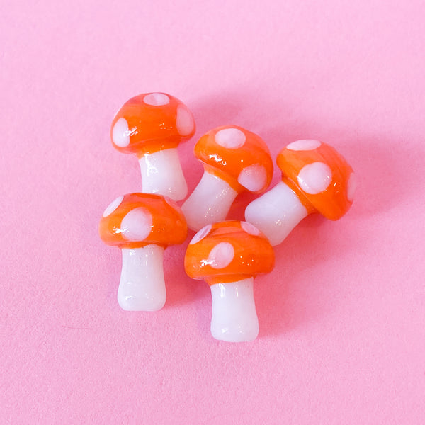 Glass mushroom beads in orange