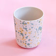 Reusable cups made of bamboo with a speckle pattern in shades greens and yellows