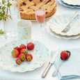 Speckled Reusable Bamboo Cups and Plates on a table with strawberries and Pie