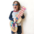Boy with handmade guitar from virtual Art class inspired by Joni Mitchell
