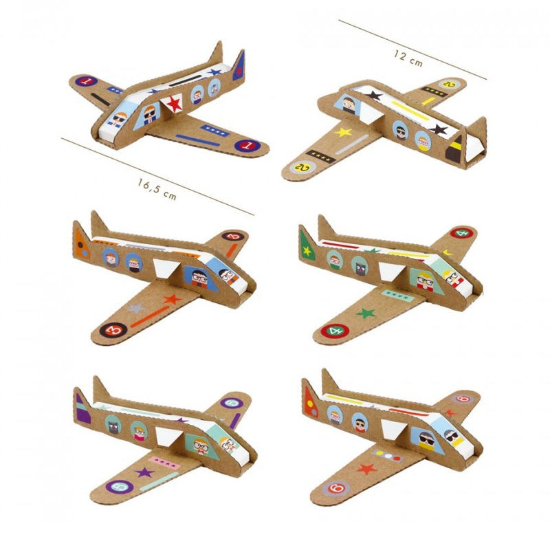 Paper airplanes with stickers made from a craft kit for kids