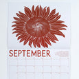 Banquet Workshop 2024 Calendar showing a sunflower for September in a big bold light brown graphic