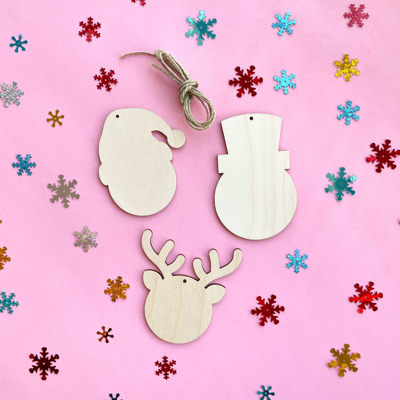 Unfinished wood ornaments for painting and craft projects with 3 classic characters: santa, a snowman, and a reindeer shape