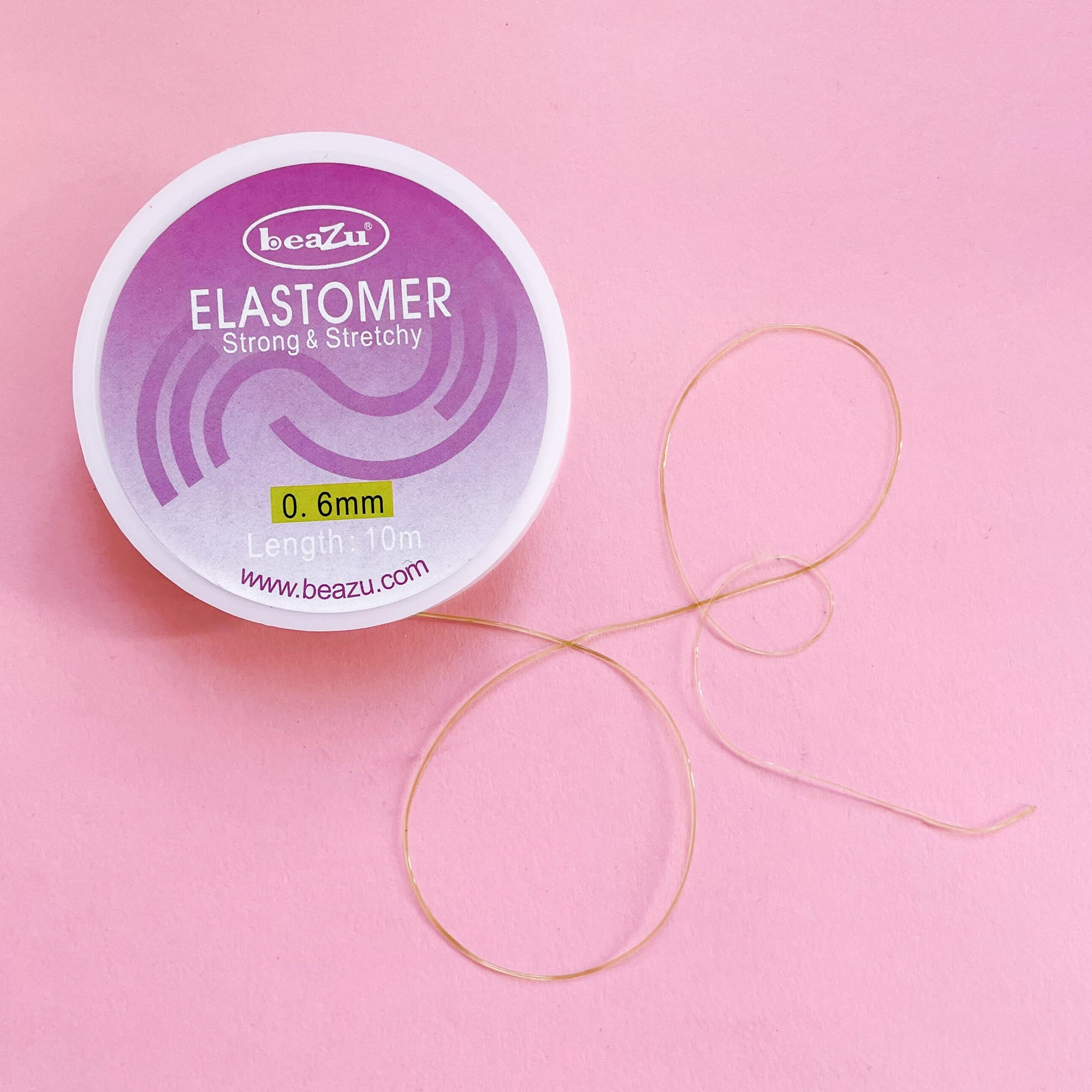 Stretchy elastic beading or jewelry cord in black 0.6mm lime thread in a 10 m spool