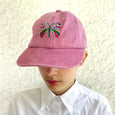 Rose pink baseball cap with a large multi-colored butterfly embroidered on the front