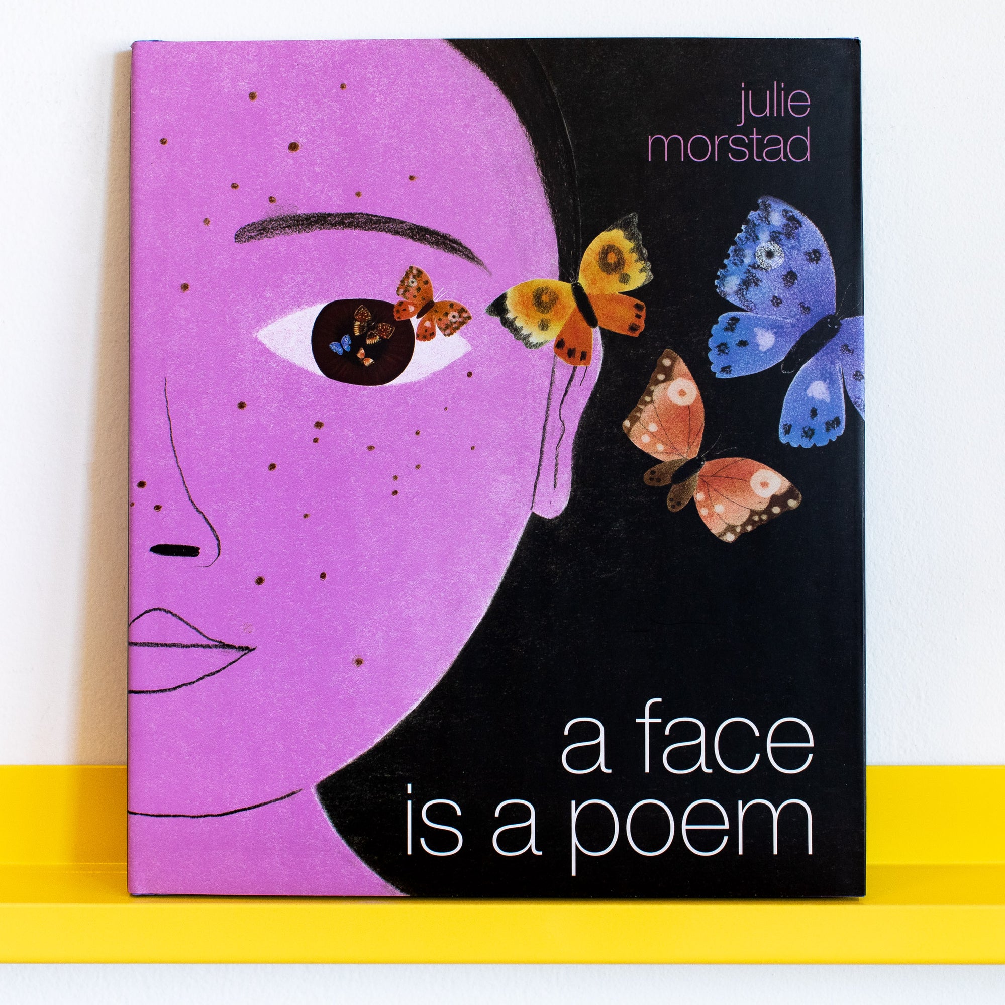 Book cover of A Face Is a Poem By Julie Morstad