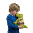 Child holding dragon stuffed toy animal