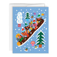 Greeting card with illustrations of elves holding presents riding a log sleigh with pine trees around them, on a bright blue background.