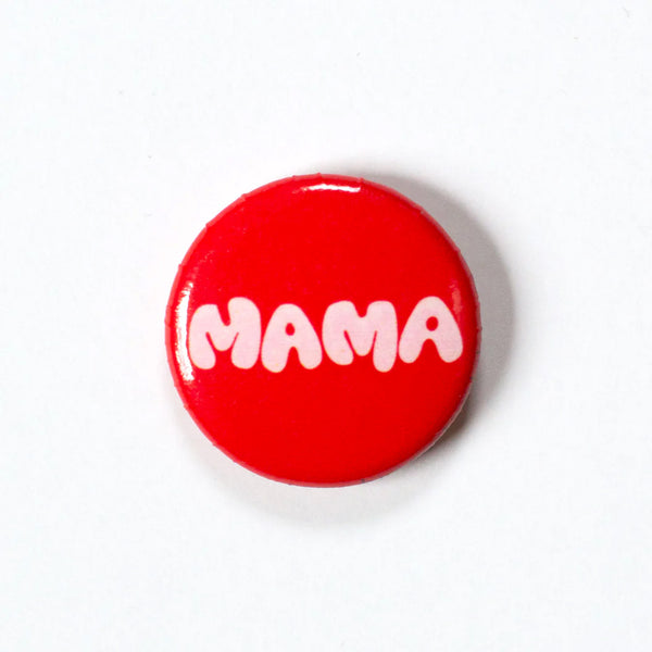 Red 1 inch button with big letters in white that say MAMA