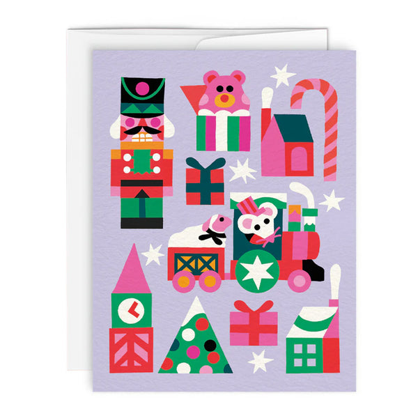 Greeting Card in lavender with colorful illustrations of holiday trees, presents, nutcracker, and a small train illustration showing a mouse driving a tiny train with sheep in back.