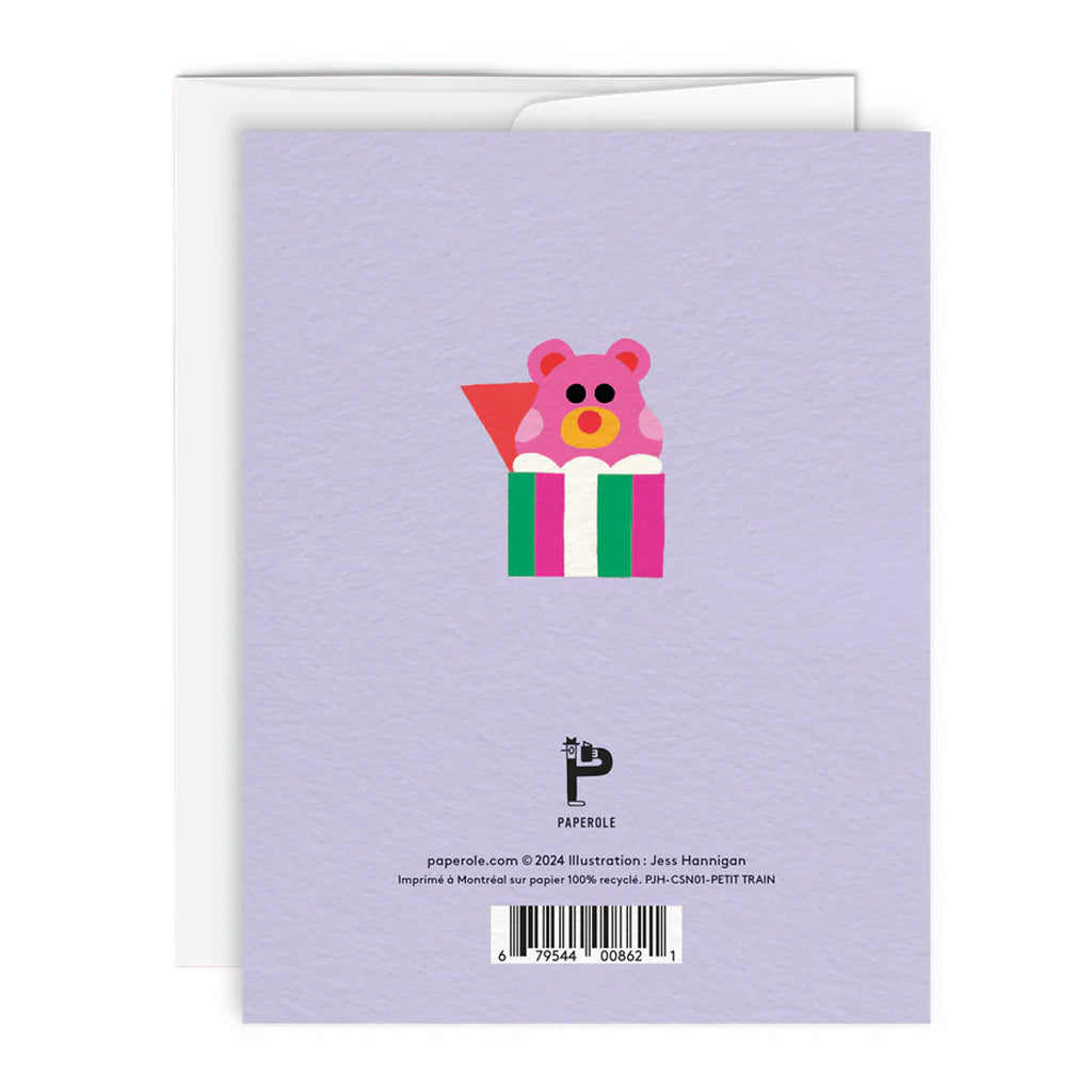 The back of a greeting card in lavender with a colorful illustration of a bear in a box and the paperole logo below.