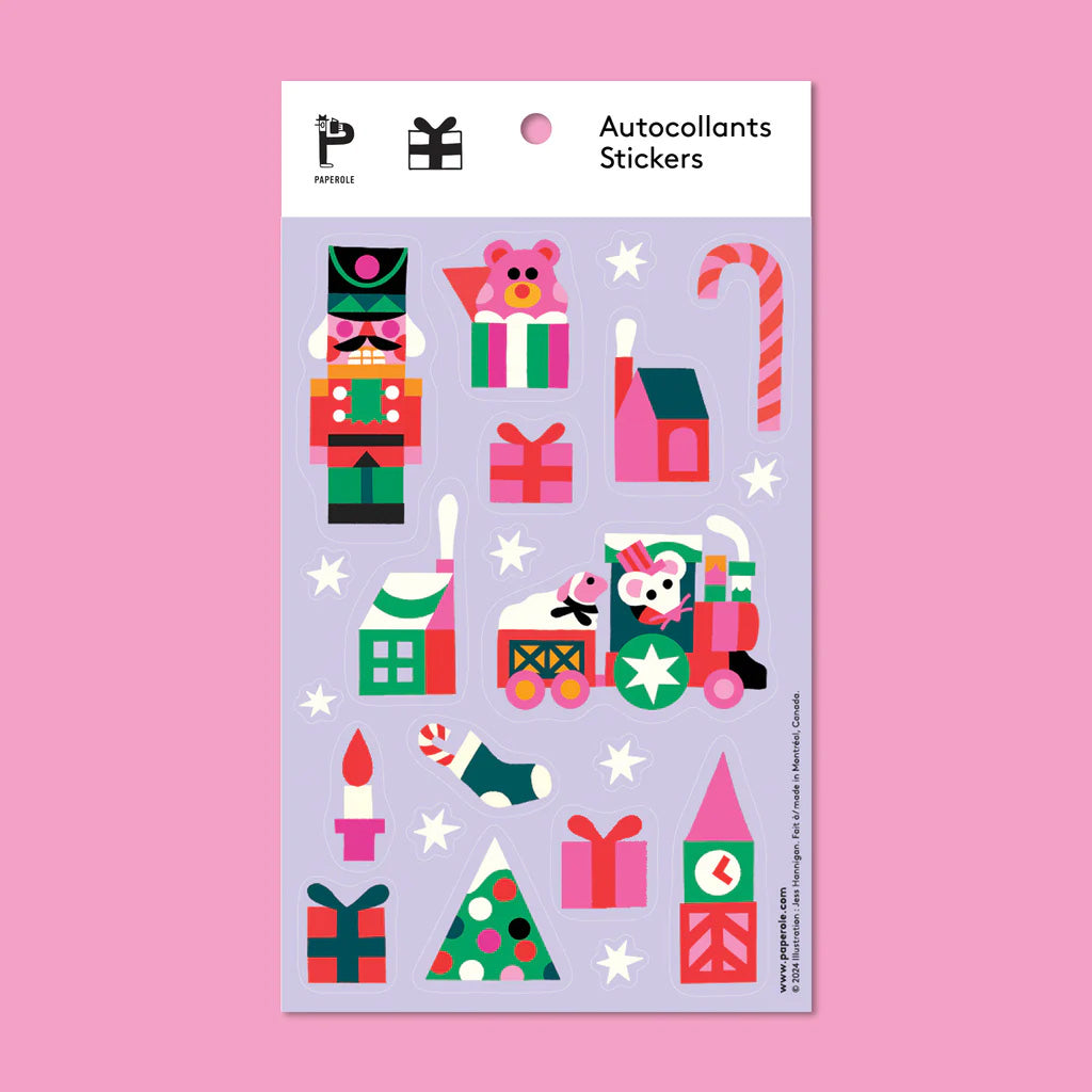 Sticker sheet in lavender with colorful illustrations of holiday trees, presents, nutcracker, candles, and a small train illustration showing a mouse driving a tiny train with sheep in back.