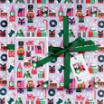 Small train gift wrap with holiday trees, presents and a small train illustration showing a mouse driving a tiny train.