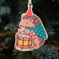 Phoebe Wahl Holiday Ornament with a hedgehog playing the drums