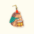 Phoebe Wahl Holiday Ornament with a hedgehog playing the drums