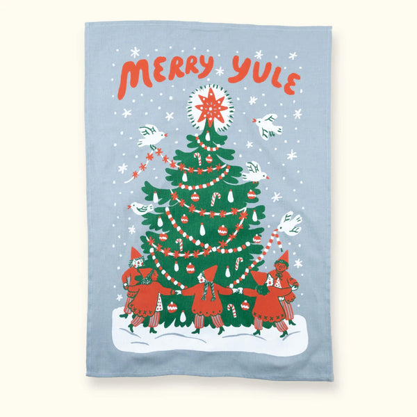 Tea Towel with a big green holiday tree and people dancing underneath and the words 'Merry Yule' across the top in red