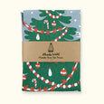 Phoebe wahl Merry Yule tea towel in an eco friendly package with simple paper band