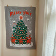 Phoebe wahl Merry Yule tea towel hanging on the wall as a decoration