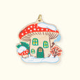 Wooden Winter Mushroom House Ornament with a red cap mushroom and snow on the ground