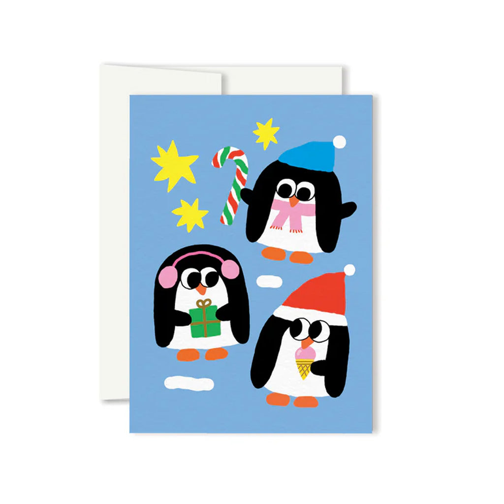 Greeting card with illustrations of three penguins wearing winter hats and each separately holding a present, a candy cane and and an ice cream cone all on a bright blue background.