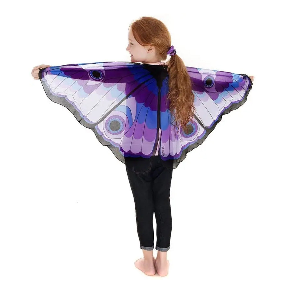 Child wearing large purple butterfly wings