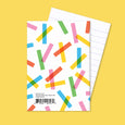 Ripples small pocket notebook with an illustration of overlapping colorful lines on the cover and lined paper inside