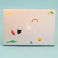 Back of a laptop with rainbow, ghost, frog, watermelon, leopard, shark, rainbow and alligator stickers all over the back