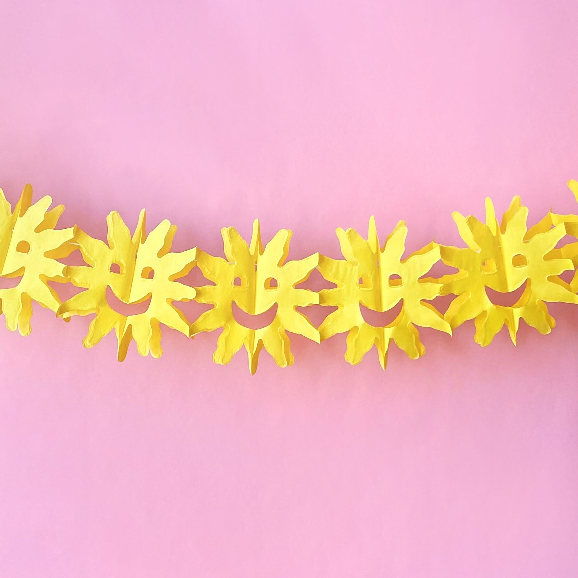 Tissue Paper Garland with a smiling sun in yellow