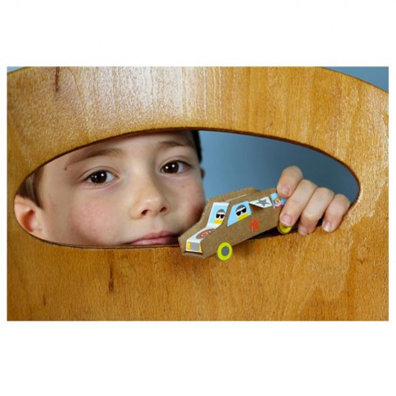 Child holding a paper car decorated with stickers