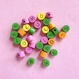 Round wood alphabet beads in bright pink, yellow, green and orange