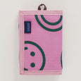 BAGGU Nylon Wallet with a happy face pattern in raspberry color