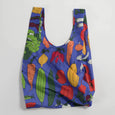BAGGU Standard Reusable Bag in Farmer's Market Pattern with vegetable illustrations on a navy tote bag