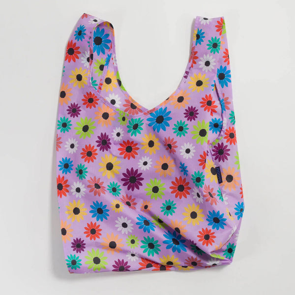 BAGGU Standard Reusable Bag in Wild Daisy Pattern with colorful flowers on a lavender tote bag