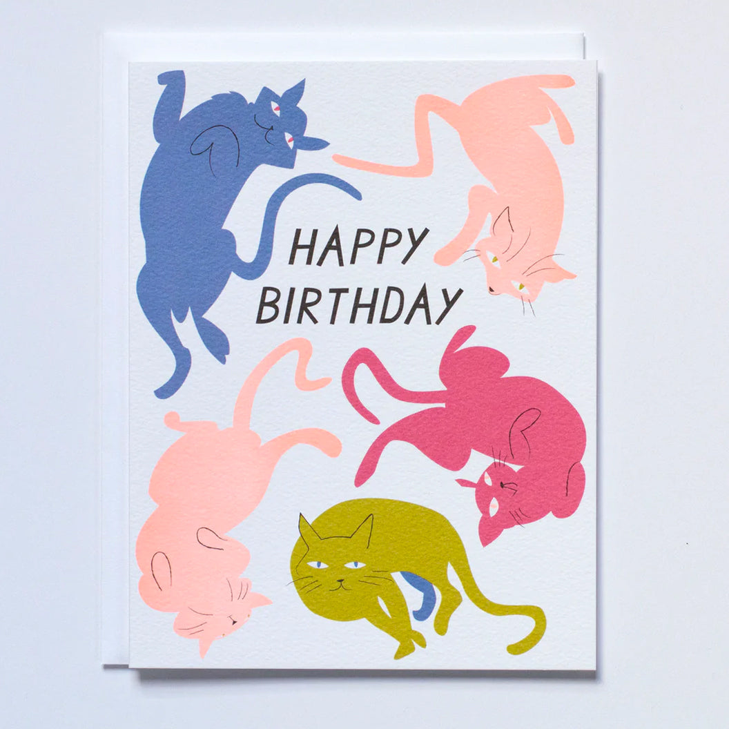 Greeting card with the words "happy birthday" surrounded by colorful cat illustrations