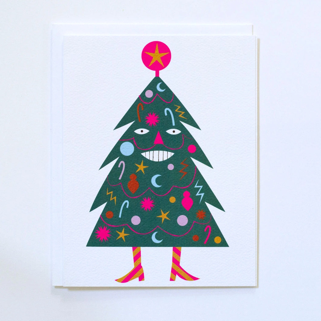 Greeting Card by Banquet showing a decorated green holiday tree with a smiling face, mustache, neon pink garlands and ornaments