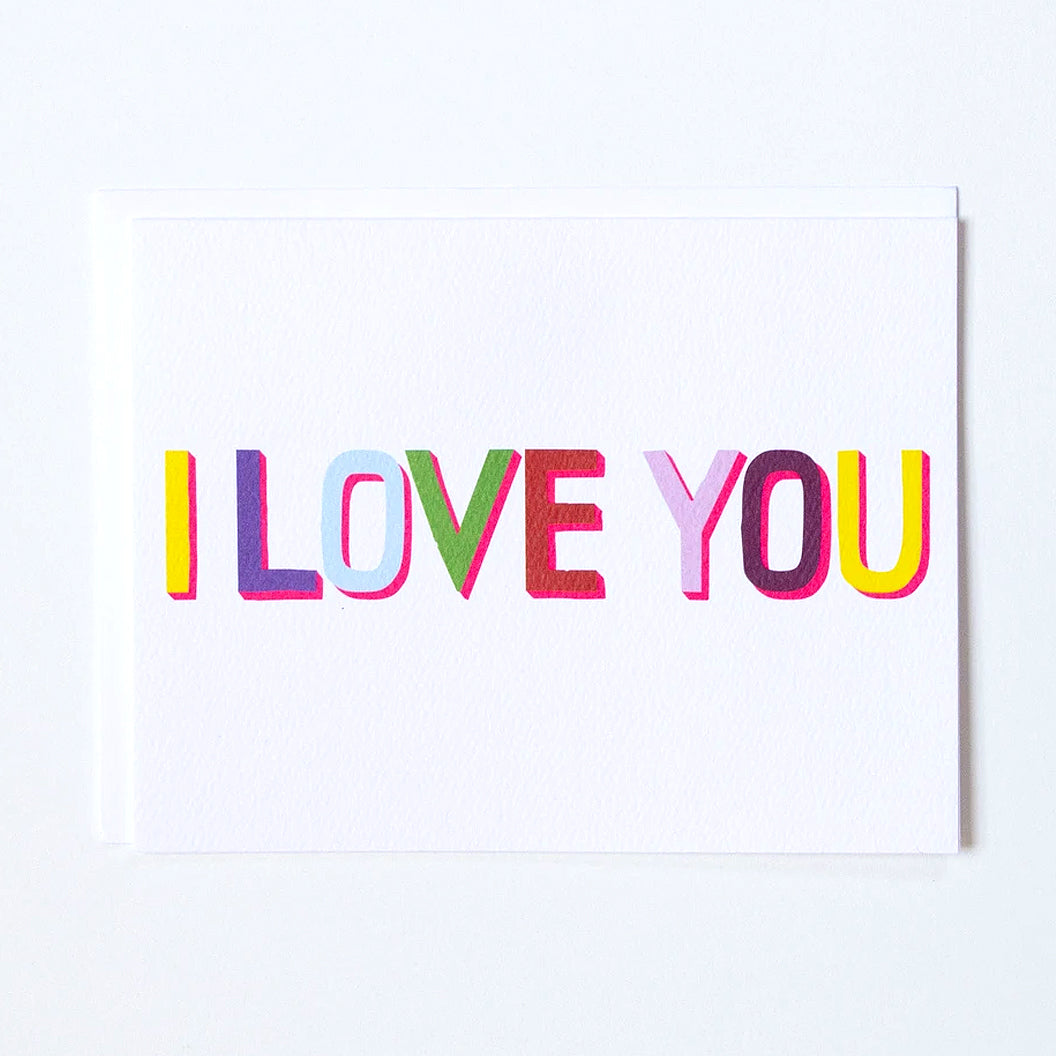 Greeting Card in Multi-coloured letters that say "I love you" by Banquet Workshop