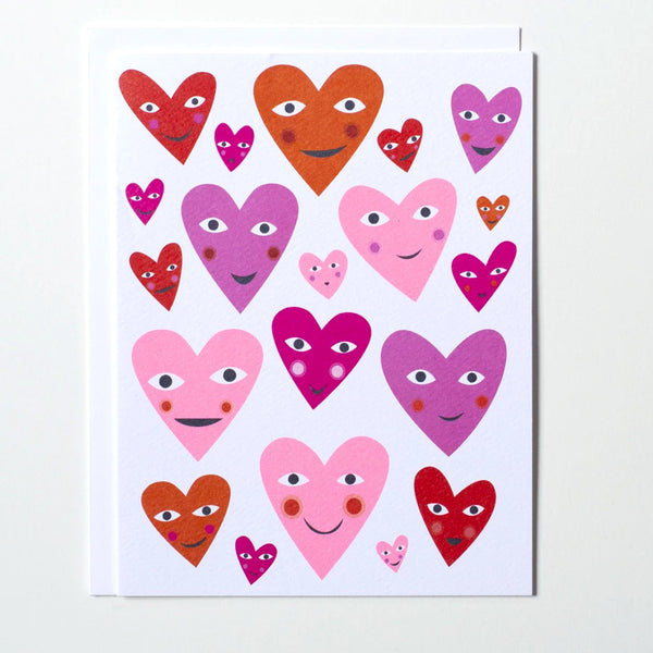 Love or Valentine Greeting card with many smiling heart illustrations in various shades of pink and red by Banquet Workshop