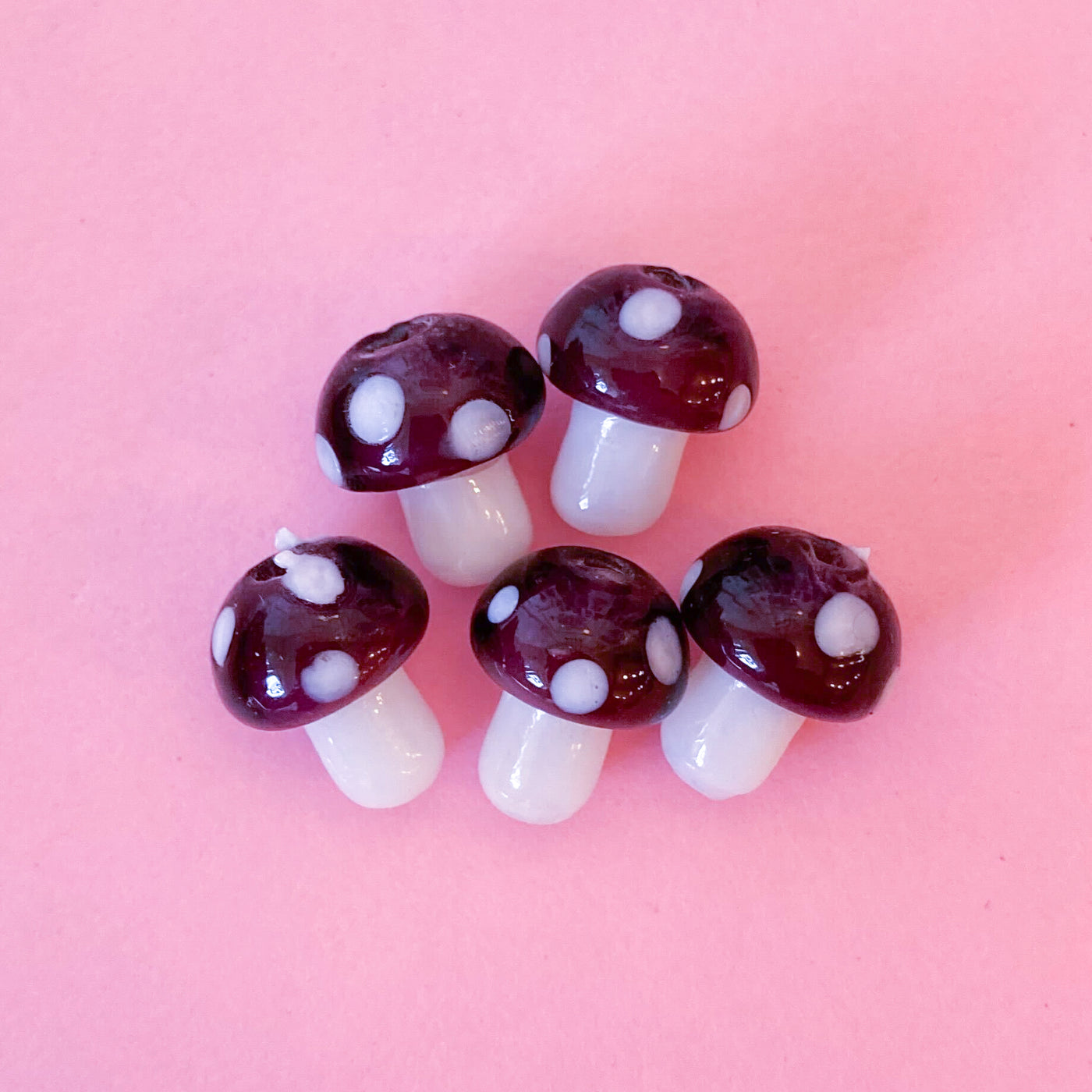 Glass mushroom beads in purple