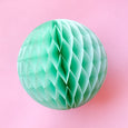 Paper honeycomb ball decoration in mint and 8 inches across