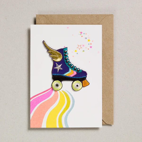 Greeting Card with an iron on patch rollerskate in purple with yellow wheels and a gold wing
