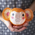 Hands holding a Monkey with pink cheeks Japanese Paper Ball Balloon by Petra Boase