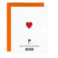 Back of little faces greeting card with a small red heart on a white background and an orange envelope