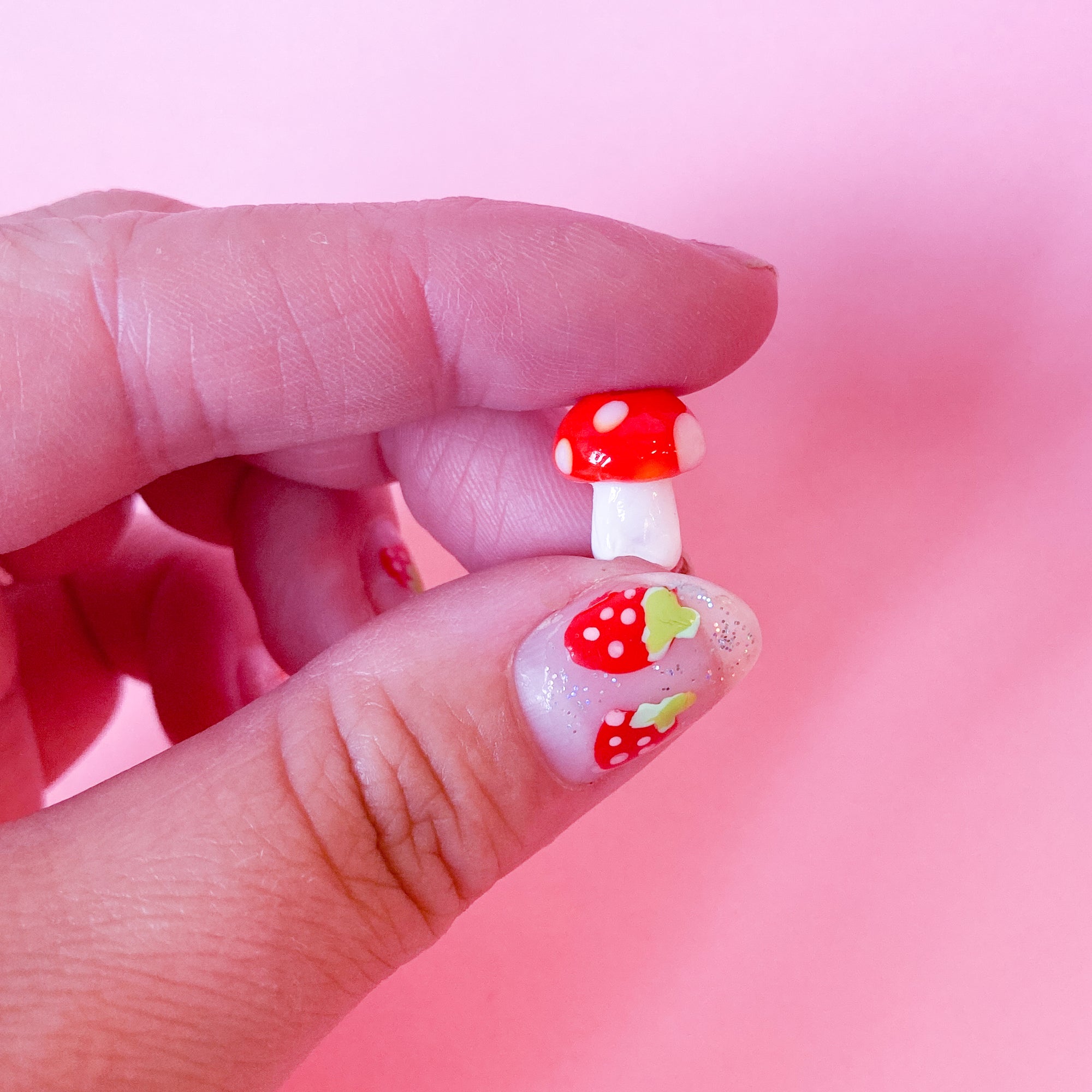 Glass mushroom beads in light red