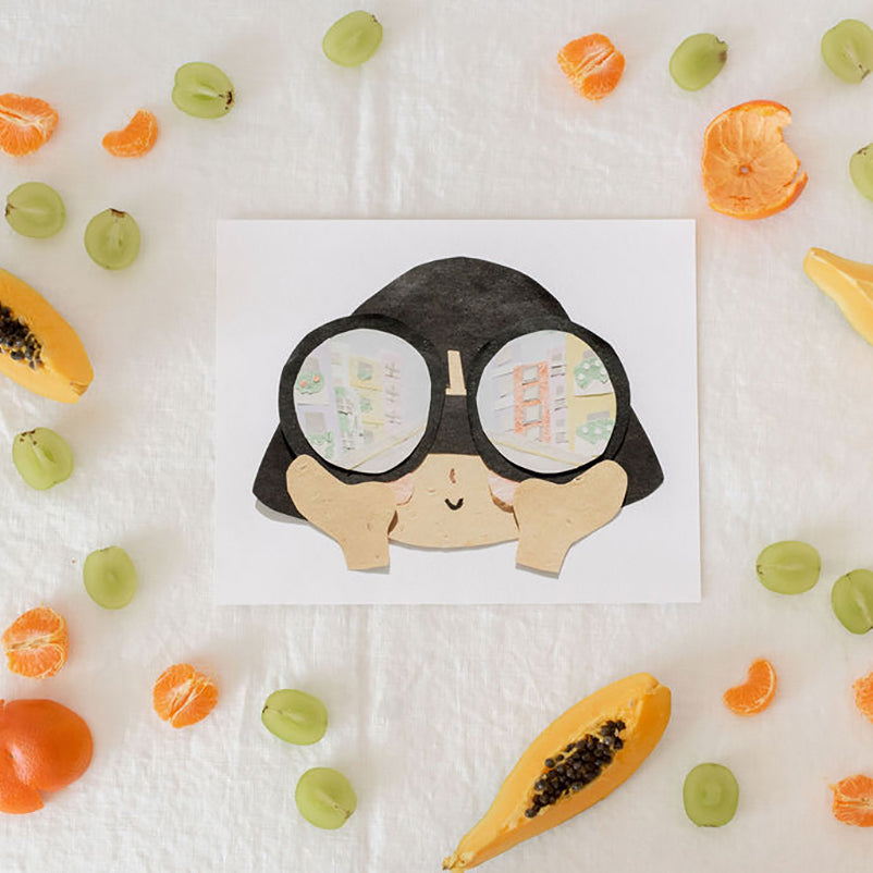 Neets Anita Cheung paper cut art print with a child looking though binoculars at a city scene