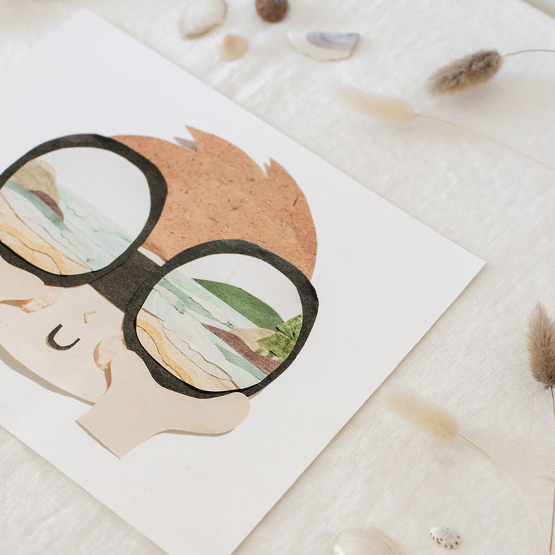 Neets Anita Cheung paper cut art print with a child looking though binoculars at the beach and ocean