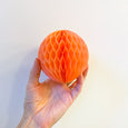 Honeycomb paper ball decoration in peach color and 4" in size by petra boase