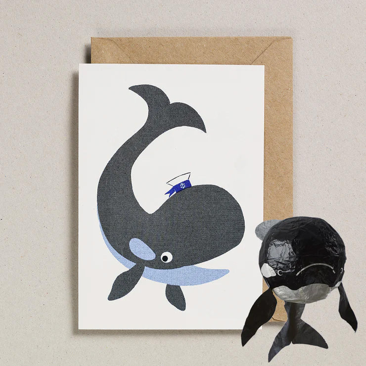 Greeting card with an illustration of a black and blue whale along with a  japanese paper balloon whale in black and white